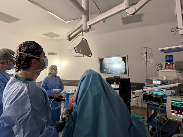 Surgical team and monitor during an arthroscopic procedure in the OR